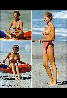 Esther Arroyo topless in red bikini pants on a beach Esther Arroyo topless in red bikini pants on a beach