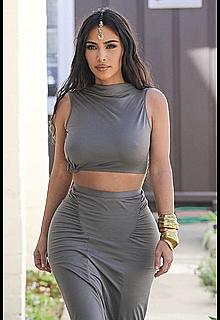 Kim Kardashian going to a wedding, shows pokies in gray top Kim Kardashian going to a wedding, shows pokies in gray top