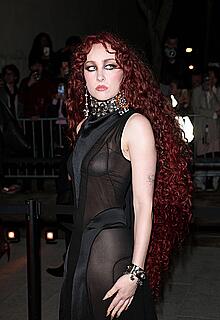 Chappell Roan braless in sheer dress at McQueen Womenswear Fall-Winter 2026-2027 show