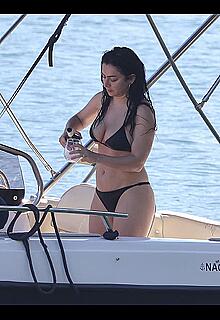 Charlotte Aitchison in bikini on a boat at Lake Como, Italy - August 26, 2026