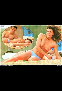 Italian actress Claudia Ruffo sunbathing topless on the beach