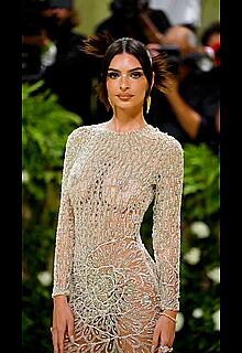 Emily Ratajkowski braless in a sheer dress