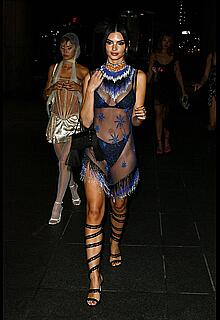 Emily Ratajkowski in a sheer ensemble attends the Met Gala After Party with friends