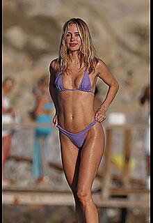 Kimberley Garner sexy in a purple tiny bikini on the beach in Ibiza - August 15, 2026