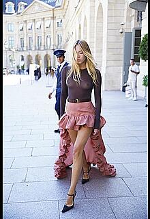 Lila Moss braless in see through dress heading to the YSL show during Paris Fashion Week