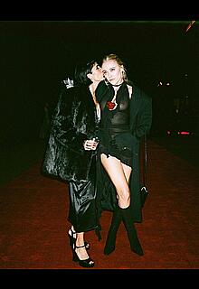 Maika Monroe braless in see throough dress at Born x Raised Sadie Hawkins Winter Formal Event in LA