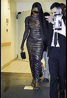 Megan Thee Stallion braless in sheer dress before the runway of Roberto Cavalli show in Milan