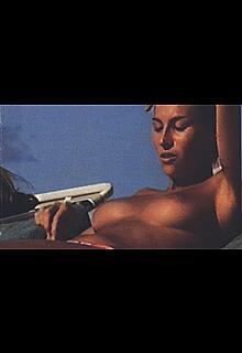 Vanessa Demouy topless on a beach