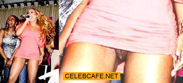 Lil Kim upskirt, shows her shaved pussy.