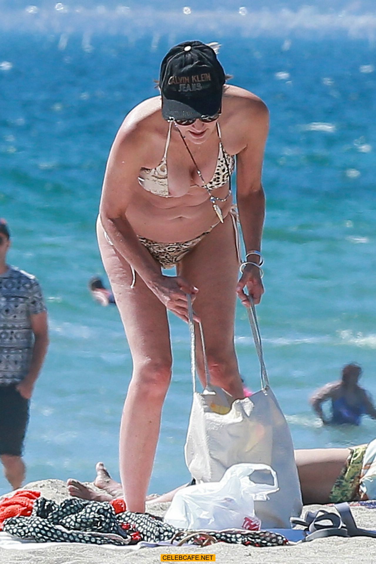 Sharon Stone tit slip in bikini in Venice. 