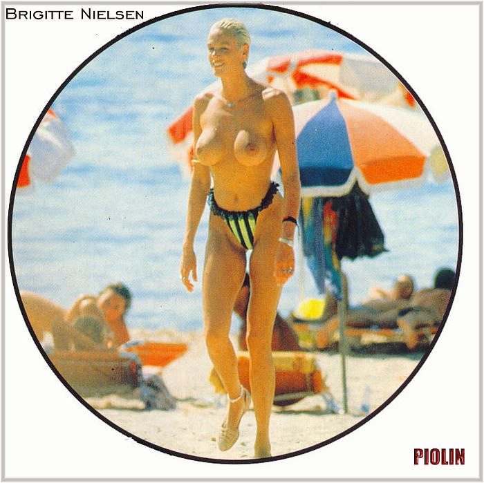 Danish actress, model, singer and reality television personality Brigitte Nielsen topless on a beach