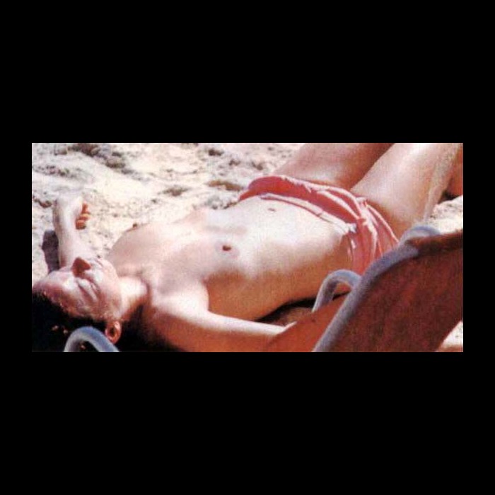 Icelandic singer Bjork sunbathing topless