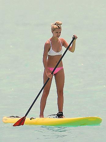 Ava Sambora paddle boarding on vacation in Bora Bora