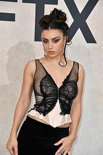 Charli XCX braless in see through dress at amFAR Gala Cannes 2022