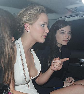 Jennifer Lawrence seen suffering a wardrobe malfunction as she leaves the The Hunger Games Mockingjay