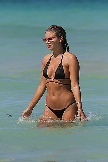 Natasha Oakley black bikini on a beach in Miami