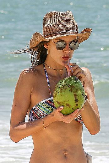 Alessandra Ambrosio sips on coconut at the beach in Brazil