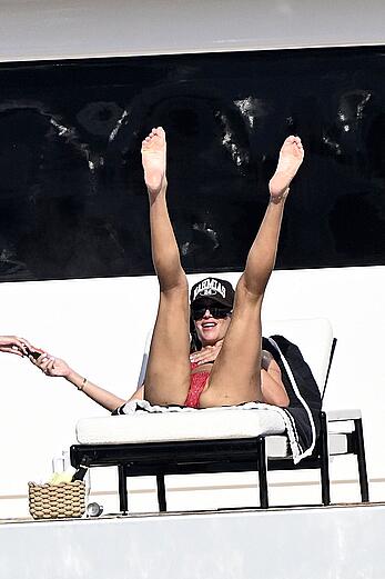 Anastasia Karanikolaou in red bikini on a yacht in Sardinia - August 13, 2026