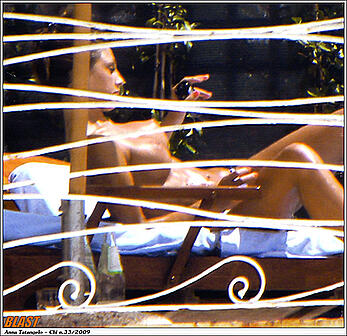 Anna Tatangelo sunbathing topless paparazzi photos
