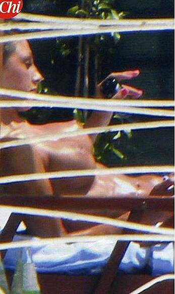 Anna Tatangelo sunbathing topless paparazzi photos