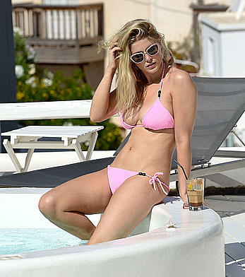 Ashley James in pink bikini at a pool in Mykonos