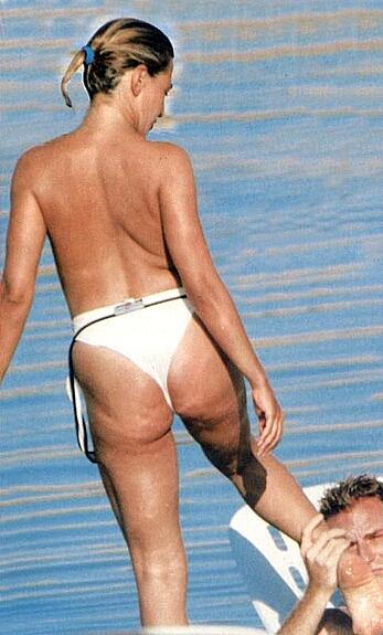 Barbara d'Urso topless on a beach paparazzi photos