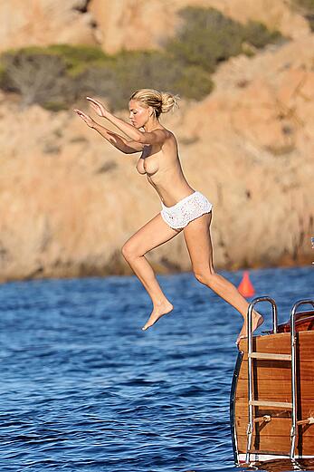 Brooks Nader goes topless in front of her parents while on holiday in Sardinia - August 09, 2026