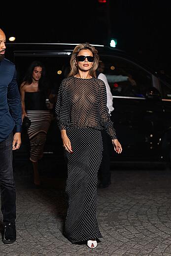 Brooks Nader braless in a sheer dress arriving at her hotel in Paris
