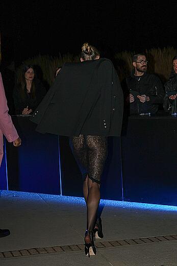 Candice Swanepoel braless in transparent top at the Vogue party in Milan