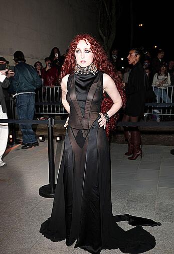 Chappell Roan braless in sheer dress at McQueen Womenswear Fall-Winter 2026-2027 show