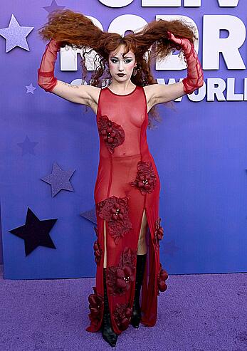 Chappell Roan braless in see through red dress at Olivia Rodrigo: GUTS World Tour premiere