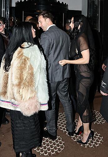 Charli XCX braless in sheer dress arrives at the Warner Music Brit Awards after party at Claridges Hotel in London