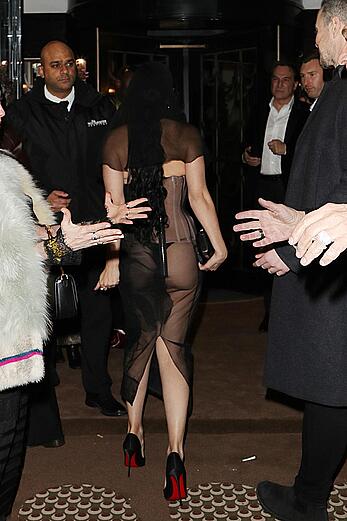 Charli XCX braless in sheer dress arrives at the Warner Music Brit Awards after party at Claridges Hotel in London