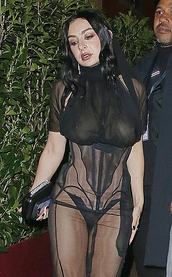Charli XCX braless in sheer dress arrives at the Warner Music Brit Awards after party at Claridges Hotel in London