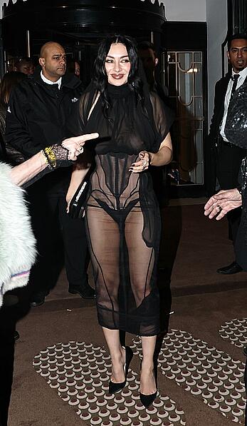 Charli XCX braless in sheer dress arrives at the Warner Music Brit Awards after party at Claridges Hotel in London