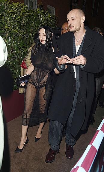 Charli XCX braless in sheer dress arrives at the Warner Music Brit Awards after party at Claridges Hotel in London