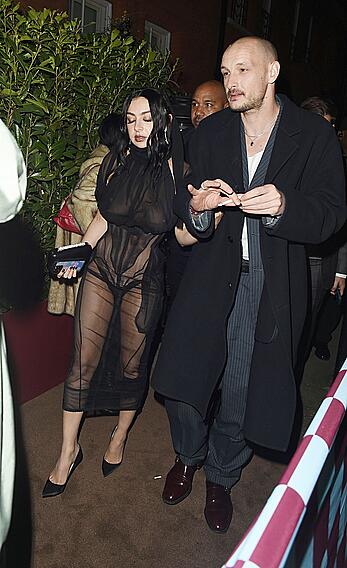 Charli XCX braless in sheer dress arrives at the Warner Music Brit Awards after party at Claridges Hotel in London