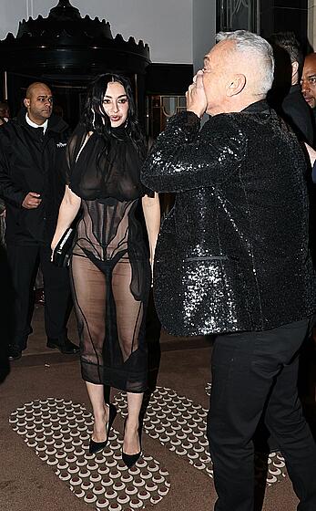 Charli XCX braless in sheer dress arrives at the Warner Music Brit Awards after party at Claridges Hotel in London