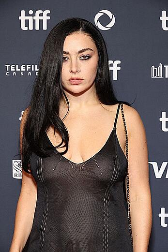 Charli XCX braless in see through mini dress at Erupcja premiere in Toronto