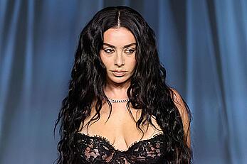 Charli XCX braless in see through dress at the Academy Museum 5th Annual Gala