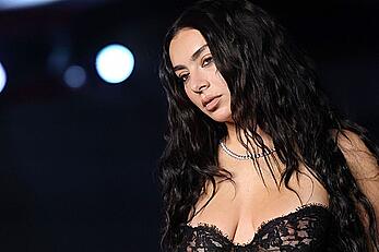 Charli XCX braless in see through dress at the Academy Museum 5th Annual Gala