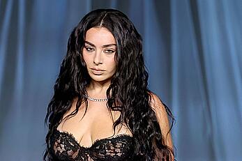Charli XCX braless in see through dress at the Academy Museum 5th Annual Gala