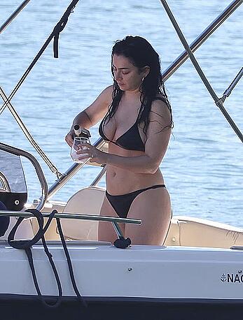 Charlotte Aitchison in bikini on a boat at Lake Como, Italy - August 26, 2026