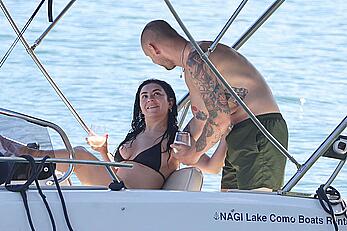 Charlotte Aitchison in bikini on a boat at Lake Como, Italy - August 26, 2026