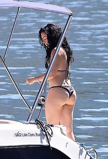 Charlotte Aitchison in bikini on a boat at Lake Como, Italy - August 26, 2026
