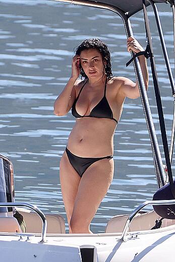 Charlotte Aitchison in bikini on a boat at Lake Como, Italy - August 26, 2026