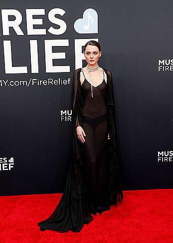 Charlotte Lawrence braless in see through dress at 67th Annual Grammy Awards in LA