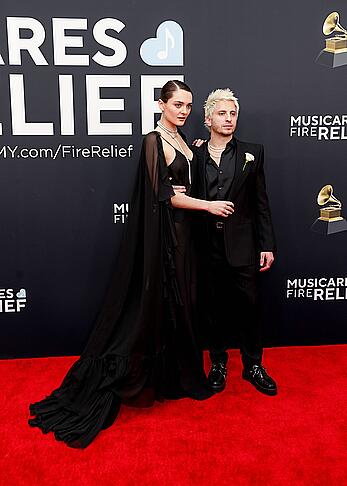 Charlotte Lawrence braless in see through dress at 67th Annual Grammy Awards in LA