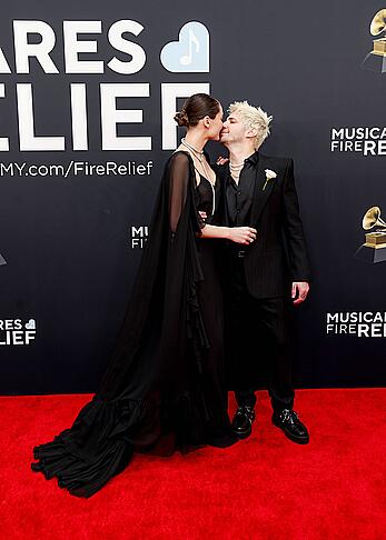 Charlotte Lawrence braless in see through dress at 67th Annual Grammy Awards in LA