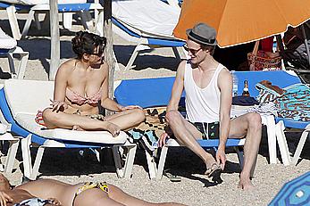 Daisy Lowe caught topless on the beach in Ibiza